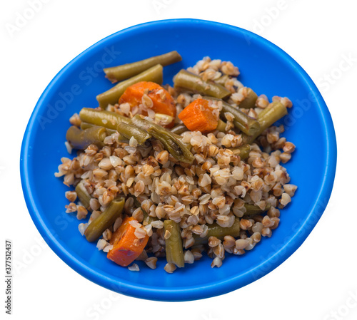 buckwheat with green beans with garlicand carrots isolated on white background. Diet breakfast on a green plate. healthy food vegetarian photo