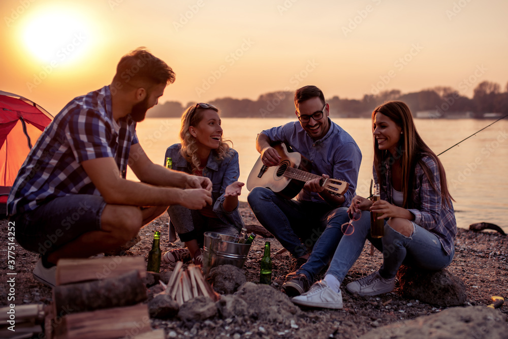 Group of friends have fun on beach