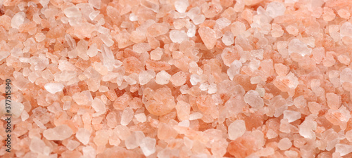 Pink himalayan salt as background, closeup view