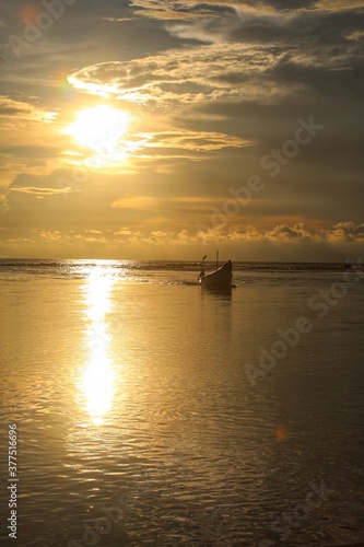 boat sails at sunset © Mike Uteshev
