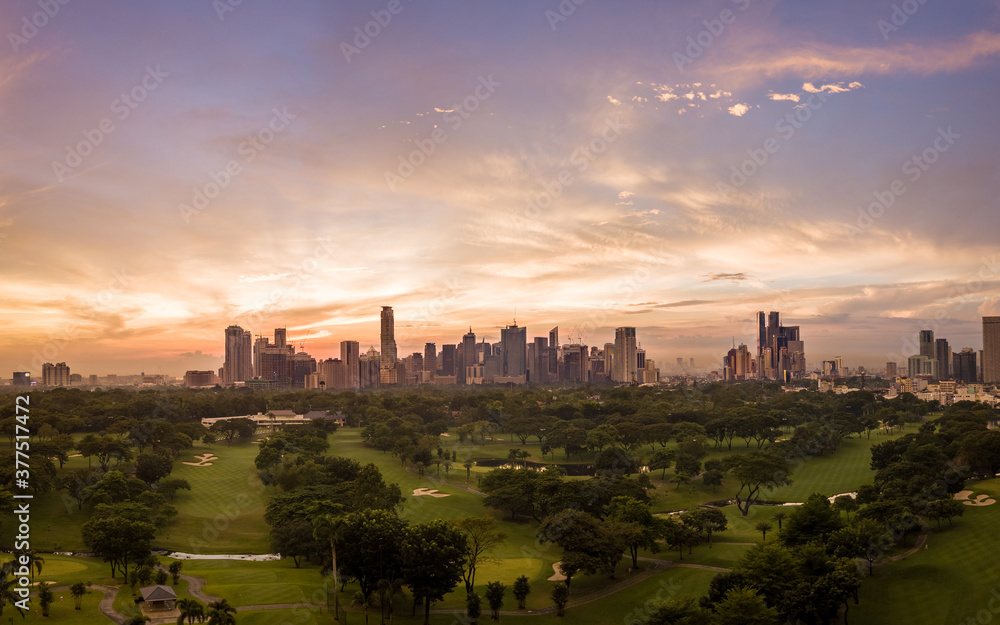 Panorama Aerial Drone Picture of the Skyline of Makati in Metro Manila, Philippines during Sunset