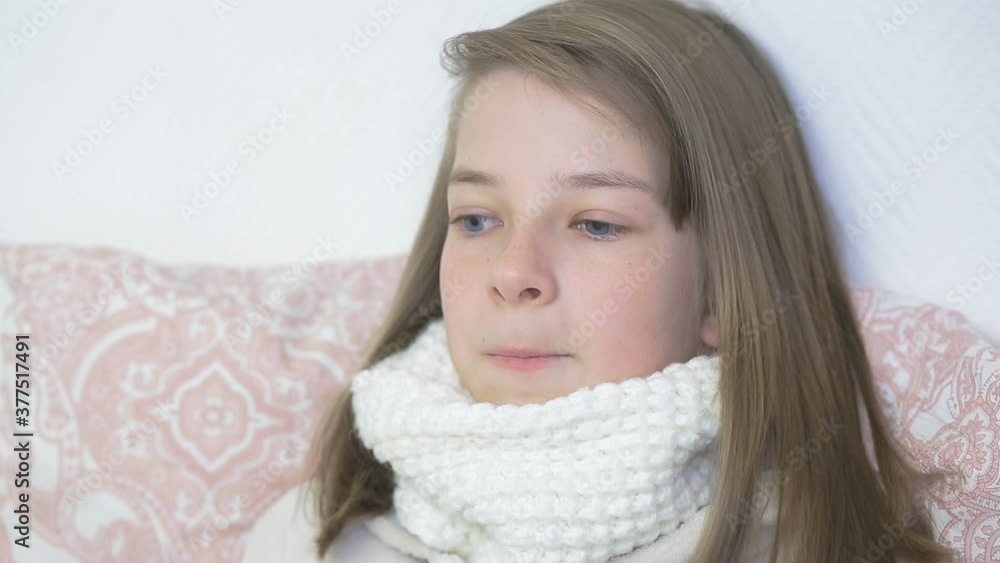 portrait of a sick teenage girl in bed taking care of children, colds and viral diseases portrait of a sick teenage girl in bed taking care of children, colds and viral diseases