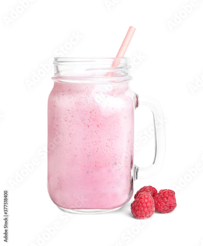 Tasty raspberry milk shake in mason jar and fresh berries isolated on white