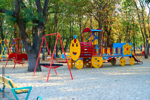 Wallpaper Mural children's playground in a city Park early in the morning, various swings and carousels Torontodigital.ca