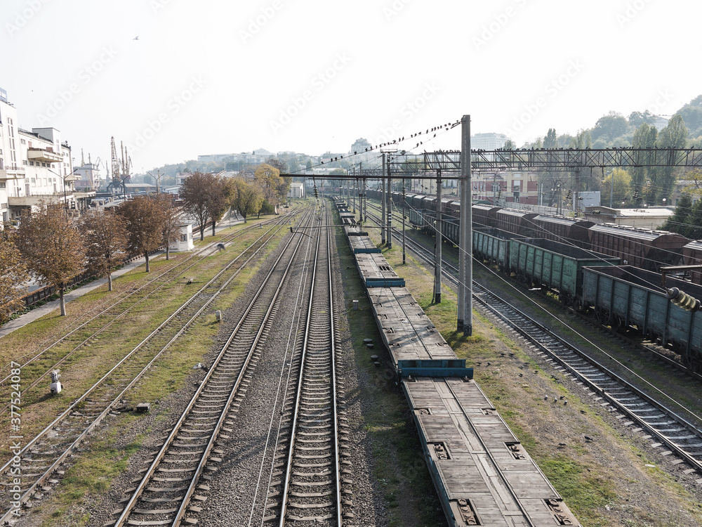 Freight trains stand in a queue for loading at the cargo terminal of the Odessa sea port. Rail transportation most economical logistics solutions