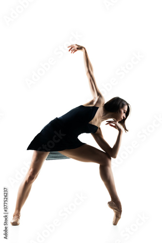 female ballet dancer posing on white background