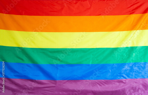 The rainbow flag, commonly the gay pride flag and sometimes the LGBT pride flag, is a symbol of lesbian, gay, bisexual, and transgender LGBT pride and LGBT social movements background texture