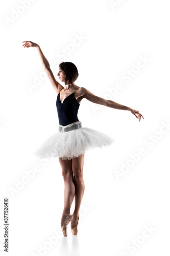 Female ballet dancer wearing tutu. Prima ballerina posing on white background