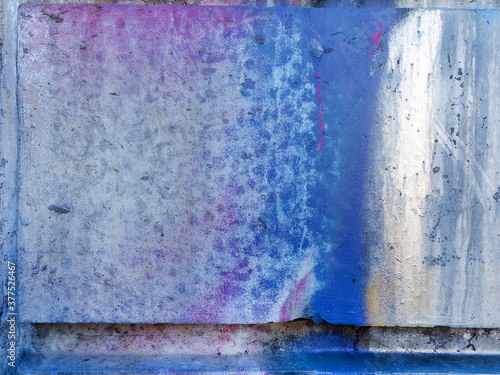 Abstract, damage to walls with many colors. Style of landscape. Rough concrete surface with cracks, scratches and paint stains. Great background or texture.