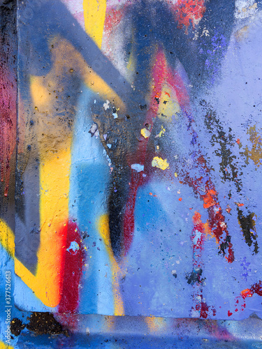 Abstract, damage to walls with many colors. Style of landscape. Rough concrete surface with cracks, scratches and paint stains. Great background or texture.