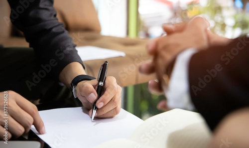 Photography Business man sign a contract investment professional document agreement in the