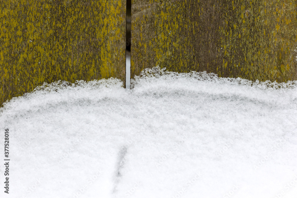 Winter landscape. Snow lies on the old wooden fence. As background. Christmas atmosphere. Winter landscape. Snow lies on the old wooden fence. As background. Christmas atmosphere.