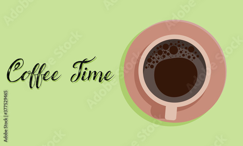 Cup of coffee on green background with some text.
