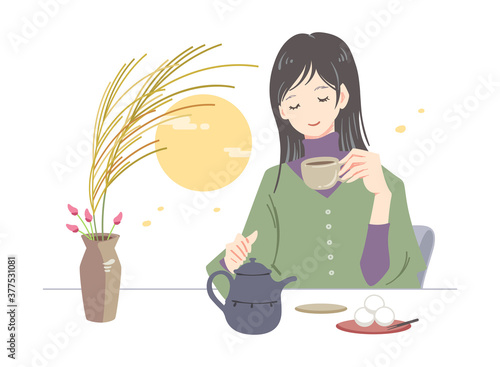 すすきの花瓶のあるテーブルでお茶をする女性（10月のイラスト）