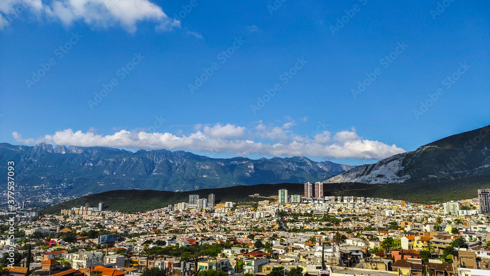 Scenic landscape of Monterrey, Mexico on a bright sunny day with a beautiful blue sky along with mountains