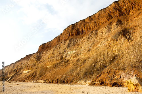 Rockslide. Mountain landslide in an environmentally hazardous area. Large cracks in earth, descent of large layers of earth blocking road. Mortal danger of dam at foot of landslide slopes of mountain