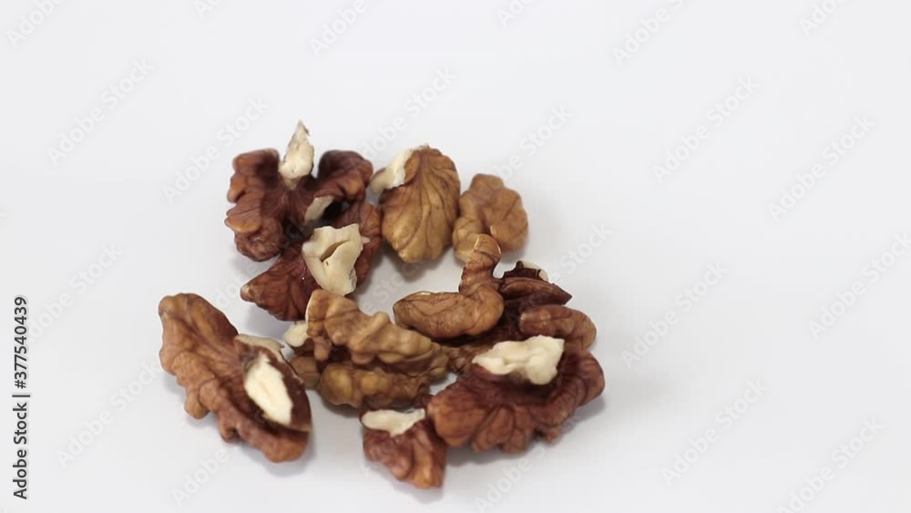 walnuts kernel rotating on white background close-up. concept of vegetarian food walnuts kernel rotating on white background close-up. concept of vegetarian food