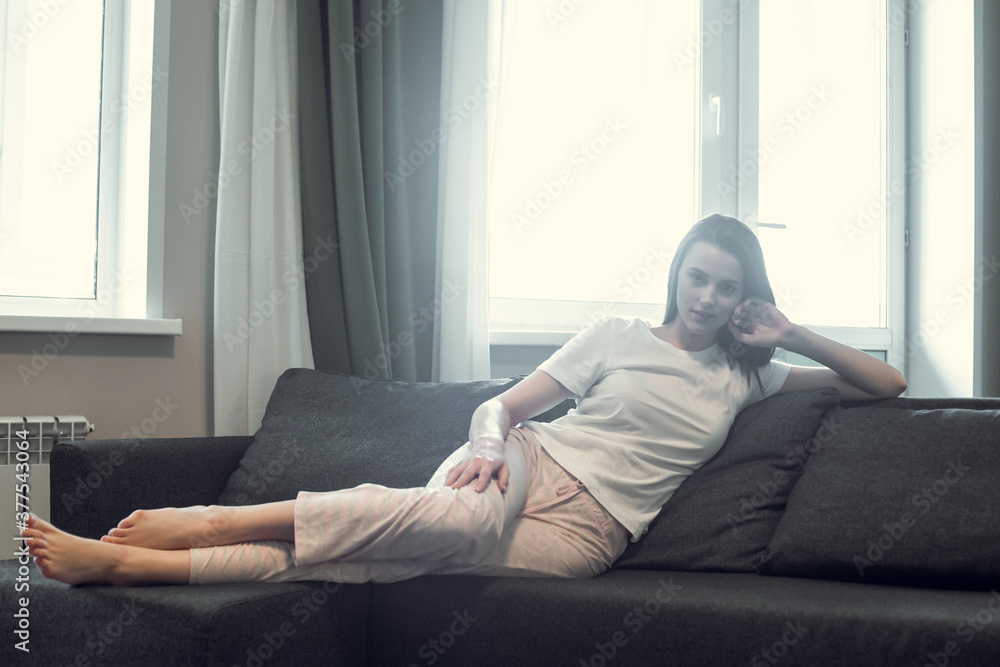 Young woman pretty relaxing on couch in living room Young woman pretty relaxing on couch in living room