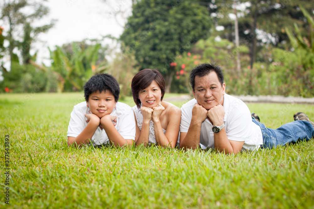 Asian family enjoying happy and joyful day out in outdoor nature Asian family enjoying happy and joyful day out in outdoor nature