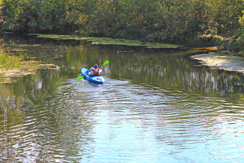 a canoe trip with a child on the autumn river