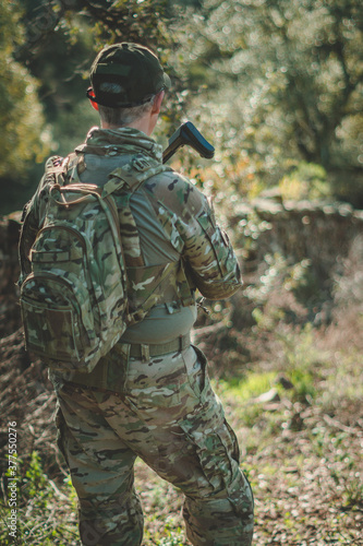 Soldier in a combat situation. Men play airsoft.