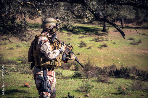 Soldier in a combat situation. Men play airsoft.