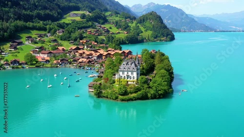 Wallpaper Mural Beautiful Schloss Seeburg castle in the middle of a blue lake. Perfect travel destination for vacations under the blue sky in Swiss - 4K Torontodigital.ca