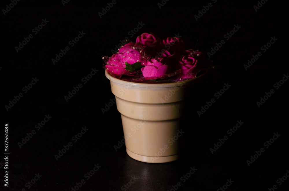 purple color roses in pots and black background purple color roses in pots and black background