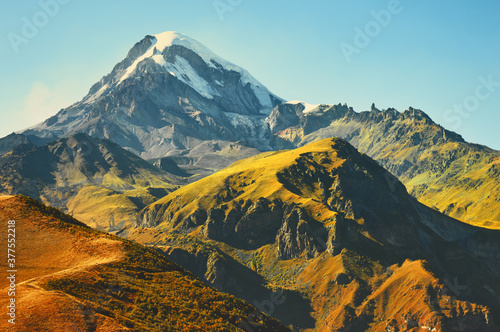 Panoramic view of Mount Kazbek in the Caucasus Mountains of Georgia is not far from the village of Stepantsminda photo