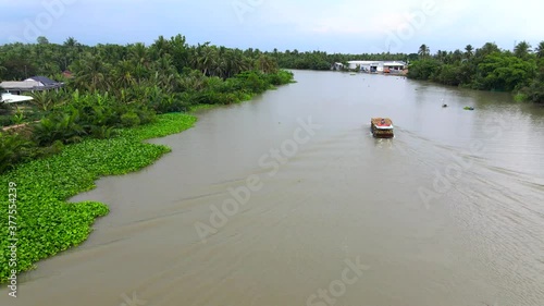 The boat carrying coconuts on the river