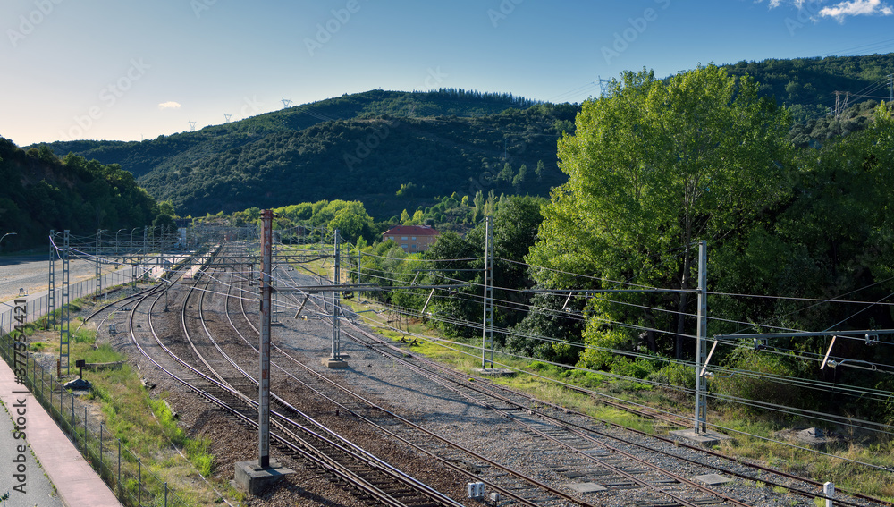 View of railway tracks in the village of Torre del Bierzo, in Castile and Leon, Spain; high angle view. View of railway tracks in the village of Torre del Bierzo, in Castile and Leon, Spain; high angle view.
