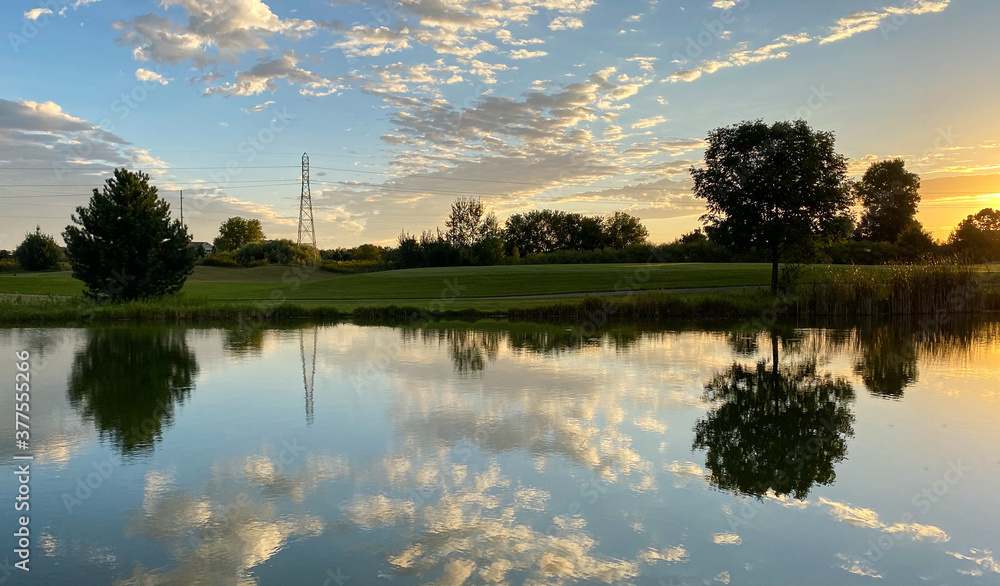 sunrise golf course pond reflections