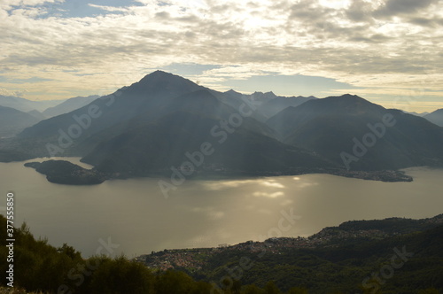 Reflections of the mountains around Lake Como in Lombardy, Northern Italy
