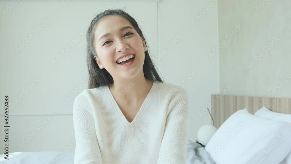 happy young asian attractive female casual cloth positive video call conversation with friend or family smiling looking at camera,Head shot portrait of cheerful young woman happy young asian attractive female casual cloth positive video call conversation with friend or family smiling looking at camera,Head shot portrait of cheerful young woman