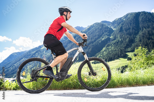 Man Riding Electric Mountain Bike