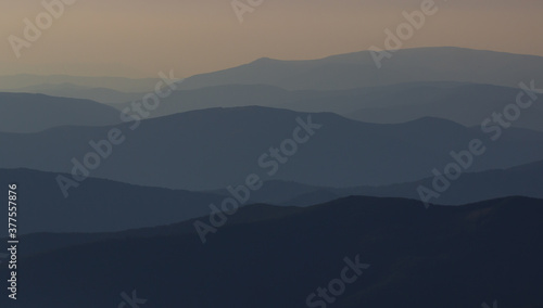 cross silhouette on the mountain at sunset © Shcherbyna