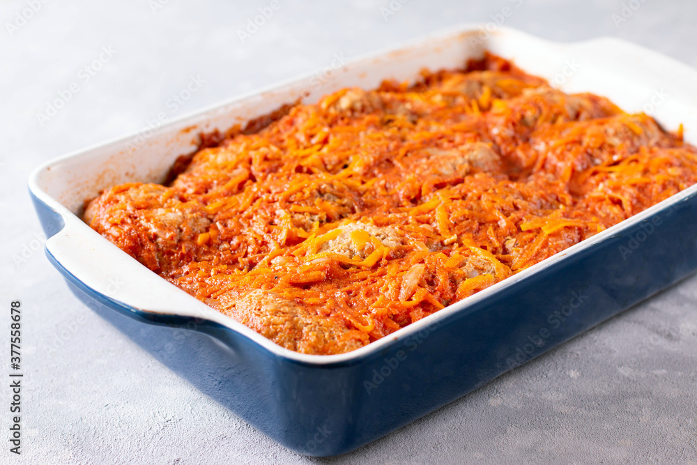 Baked meatballs with cabbage and rice in a baking dish Baked meatballs with cabbage and rice in a baking dish