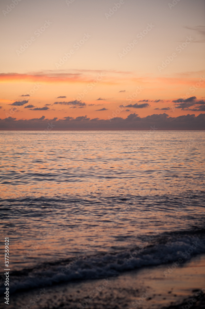 sunset at sea small waves