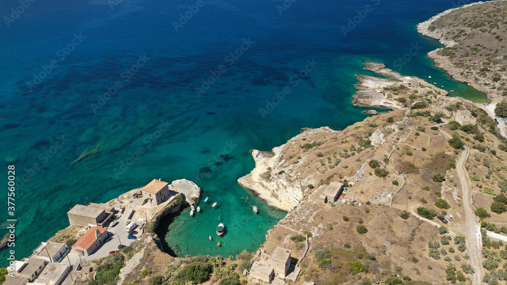 Aerial drone photo of beautiful fishing seaside village of Mezapos with crystal clear emerald beach in Mani Peninsula, Lakonia prefecture, Peloponnese, Greece