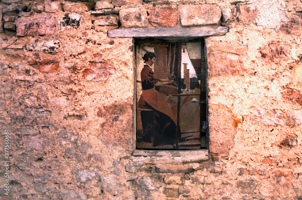 old window of an ancient italian building, very surreal with a poster with woman who looks real