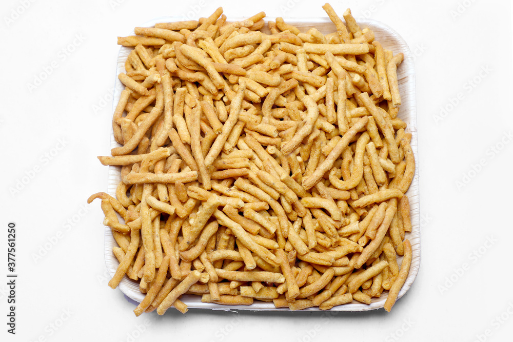 Indian snacks masala sev in white background. Indian snacks masala sev in white background.