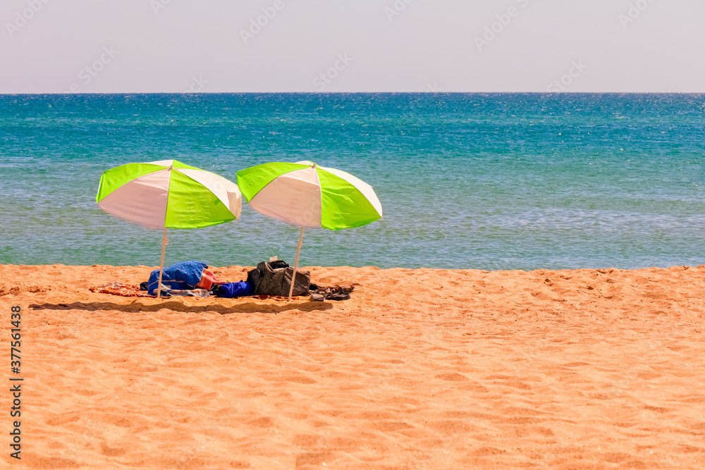 umbrellas from the sun on the beach. sea tour