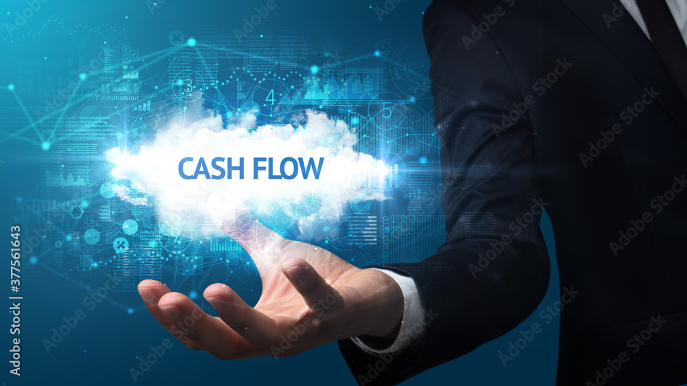 Hand of Businessman holding CASH FLOW inscription, successful business concept Hand of Businessman holding CASH FLOW inscription, successful business concept