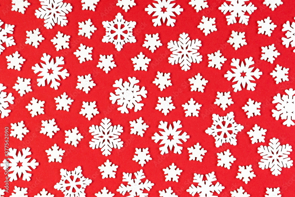 Top view of winter ornament made of white snowflakes on colorful background. Happy New Year concept with copy space Top view of winter ornament made of white snowflakes on colorful background. Happy New Year concept with copy space