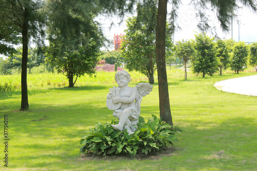 statue of a person in garden