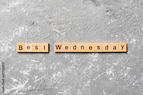 best wednesday word written on wood block. best wednesday text on cement table for your desing, concept photo