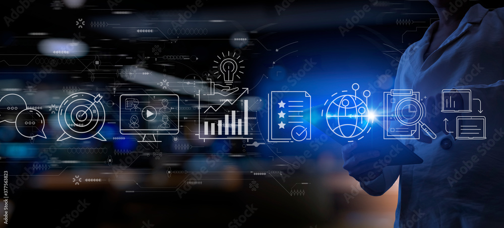 Content marketing concept with business woman using a digital tabblet computer on blur office background.