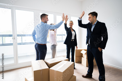 Office Relocation. Executives Making High Five