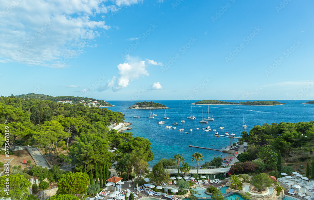 Hvar/ Croatia-August 9th, 2020: Beautiful panoramic view of islands off the Hvar town, covered in dense, pine forest, surrounded by fascinating, adriatic sea