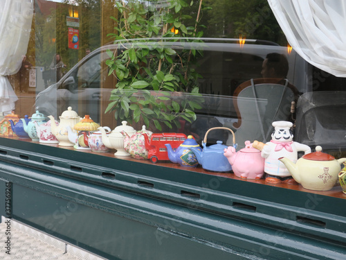 collection of teapots in the window of a hotel in Amsterdam photo